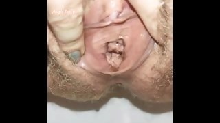 Extremely close up wide open hairy pussy pissing for your pleasure