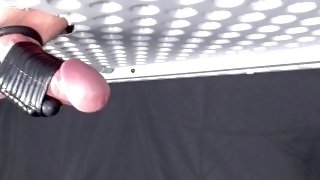 Milking my dick with vibrator sleeve while wearing cock and ball rings. Big cumshot.