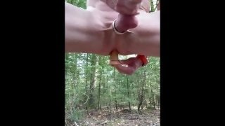 Fucking myself in a forest with a dildo.