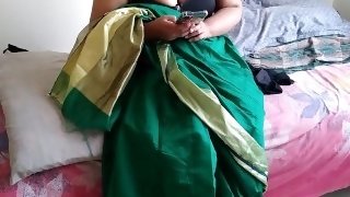 Telugu aunty in green saree with Huge Boobs on bed and fucks neighbor while watching porn on mobile