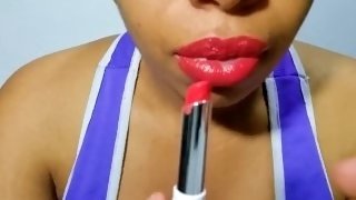 Latina with full lips paints them red and plays with her naughty tongue for you