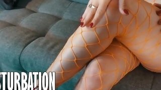 Hot legs in fishnets tease you on the couch