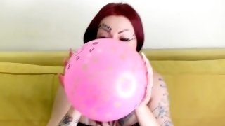 Balloon fetish. The beauty inflates the balloon and sits on it with her beautiful ass.