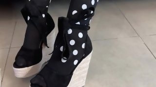 High heels and black stockings footjob and a huge cumshot
