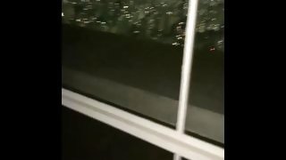 Fucking her in front of the window on the 29th floor