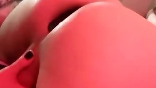Transgirl gets her buttplug punched until she has a screaming orgasm