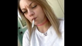 Hot babe dangling her morning cigarette