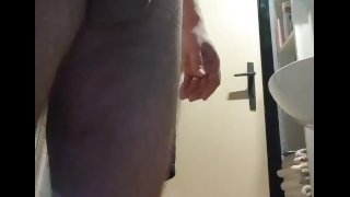 Wanking and playing with dick in bathroom