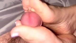 Sexy little feet give juicy cock a footjob!