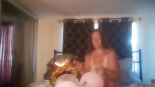Extremely horny girl takes off her dress and smokes cigarettes and pops balloons naked