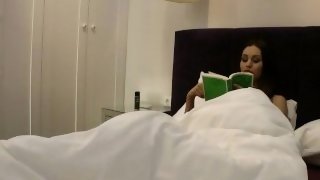 All natural tight pussy big ass hot brunette babysitter reads a book on a bed without any underwear