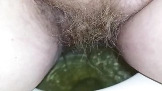 Azula Amethyst's hairy pussy pees in the toilet