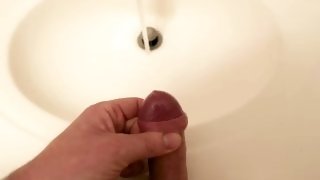 Close up while masturbating and cum or ejaculate into the bathroom sink.