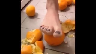 Your giantess Ashley paints her toenails and crushes tangerines with her feet