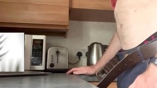 BIG LOAD on kitchen worksurface as straight guy with big cock cums hard while watching porn. Hot cum