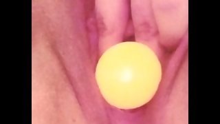 Chubby girl plays with ping-pong balls in pussy and cums