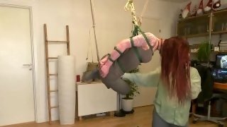 Girl in armbinder tie and crotch rope suspended and hogtied